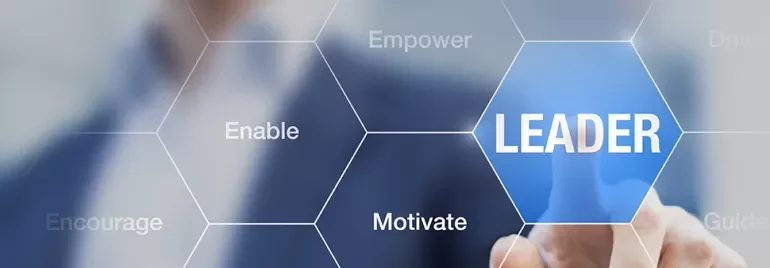 Person pointing to hexagon labeled 'Leader' among other leadership qualities.